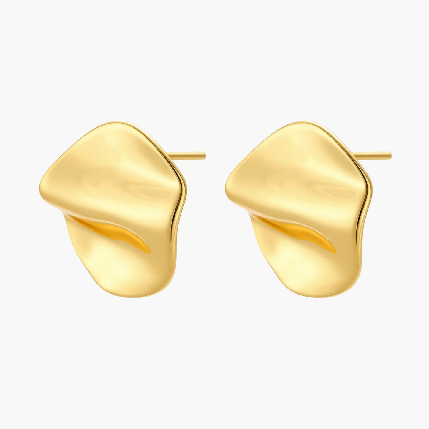 Close-up of organic gold-plated sterling silver stud earrings with flowing sculptural design and curved cut-outs